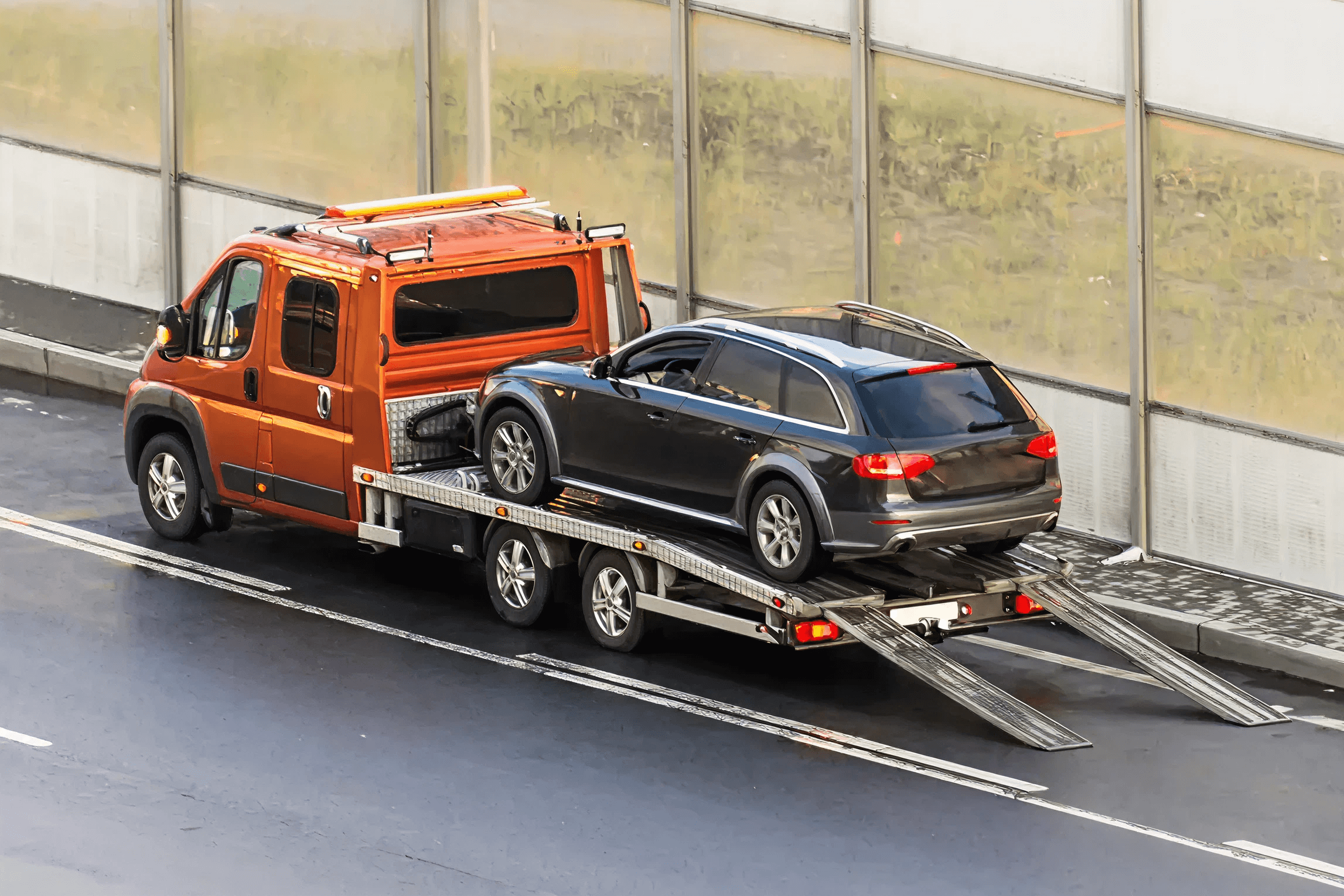 Towing truck transporting vehicle